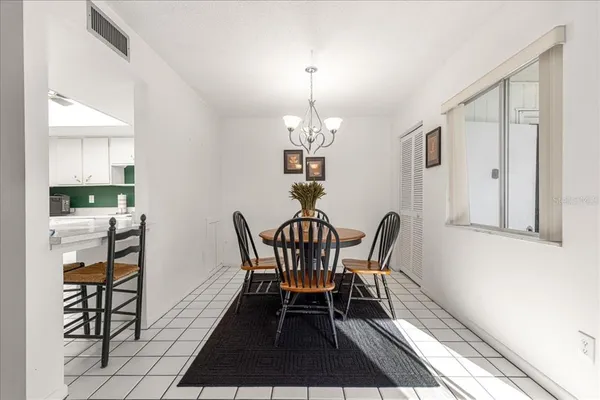 a dining room with furniture and window
