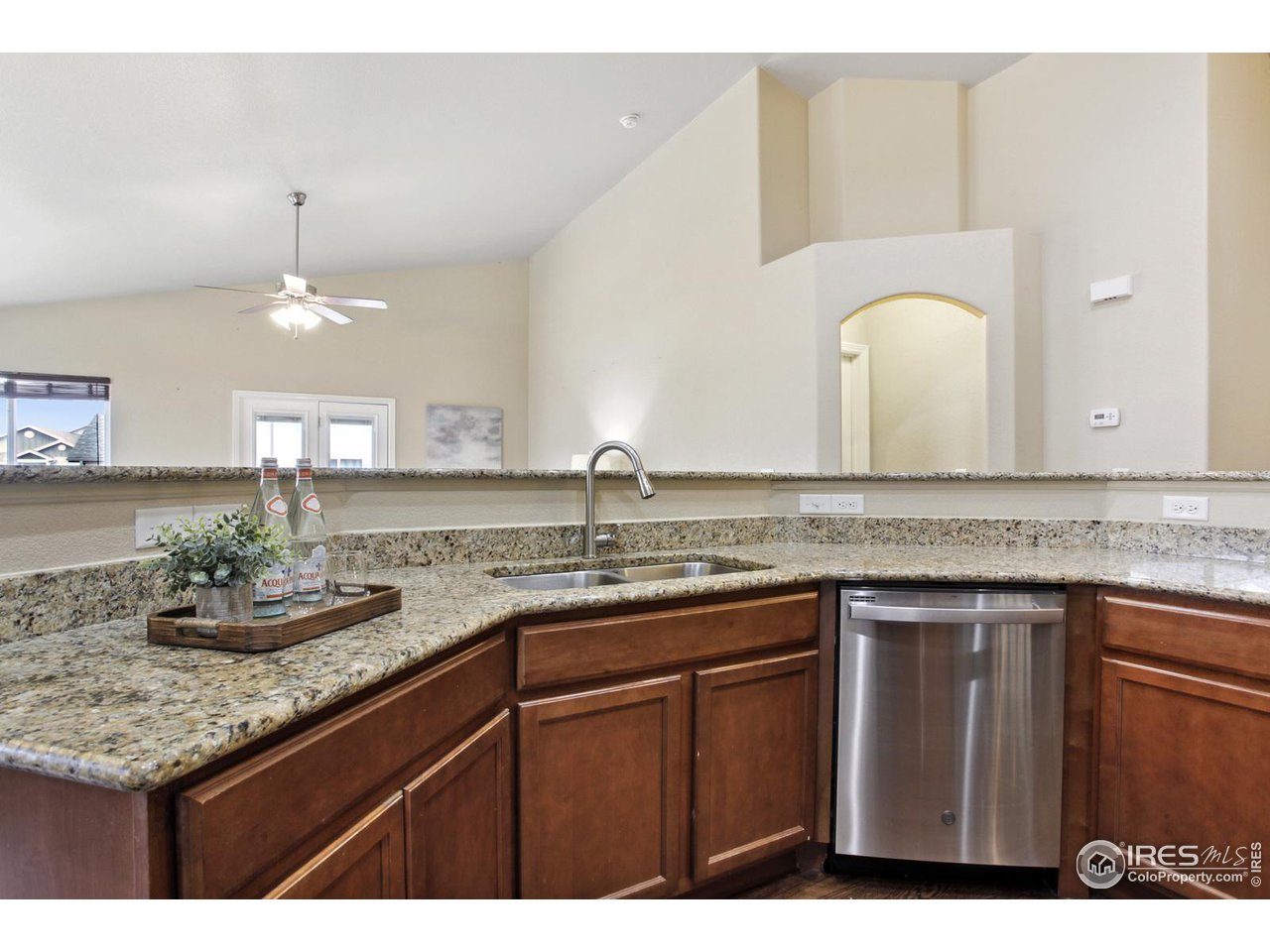 9018 Sandpiper Drive Frederick, CO 80504 - Photo 13 of 26 a kitchen with sink and cabinets