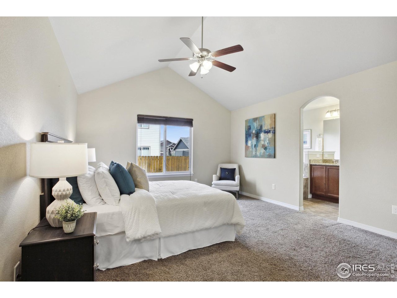 9018 Sandpiper Drive Frederick, CO 80504 - Photo 14 of 26 a bedroom with a bed and window