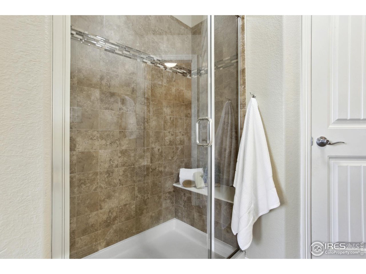 9018 Sandpiper Drive Frederick, CO 80504 - Photo 16 of 26 a bathroom with a shower