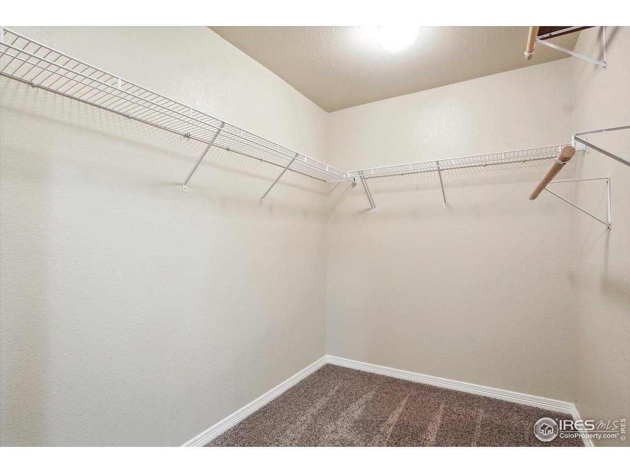 9018 Sandpiper Drive Frederick, CO 80504 - Photo 17 of 26 a view of a room with racks on the wall