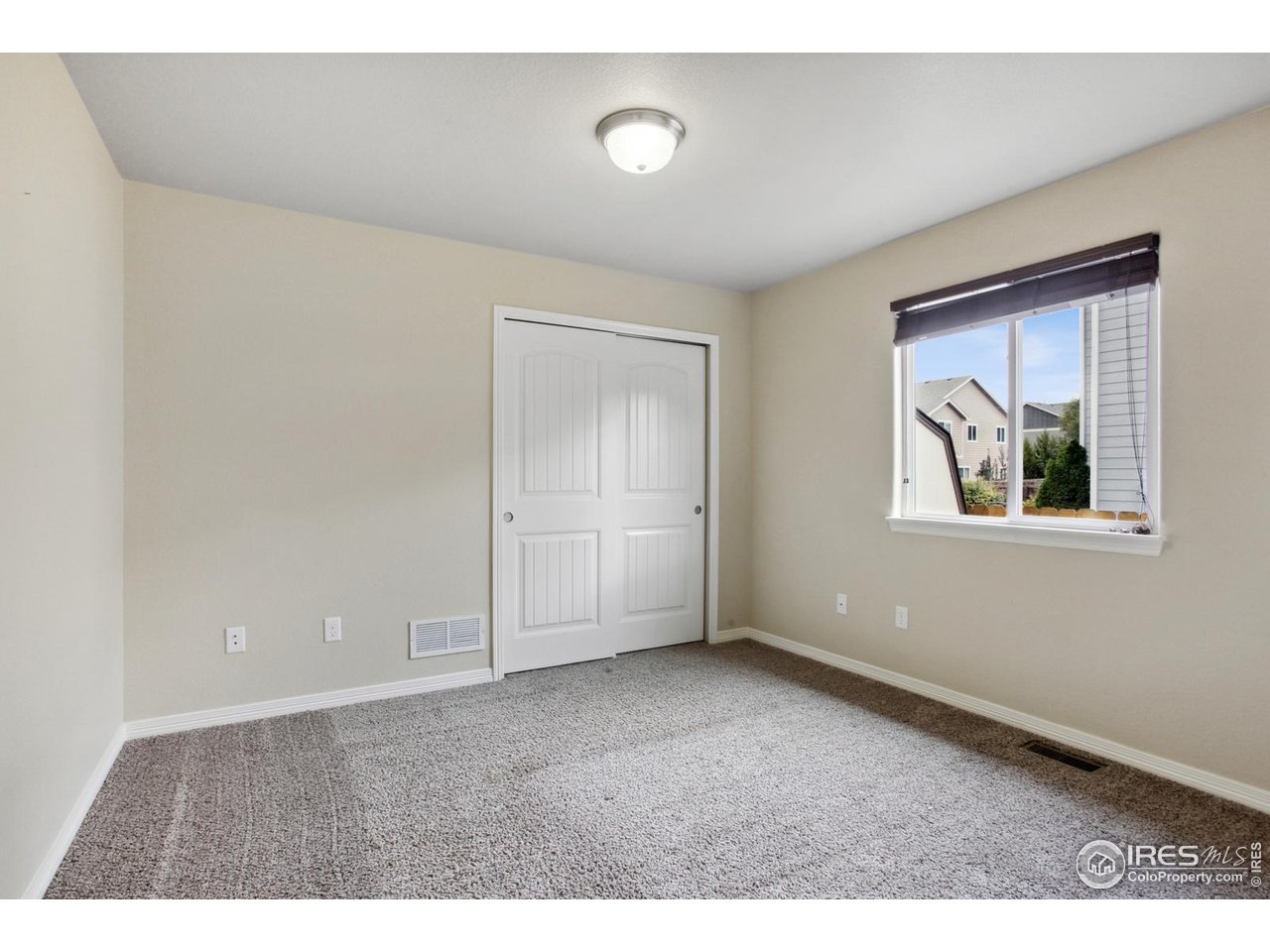 9018 Sandpiper Drive Frederick, CO 80504 - Photo 18 of 26 a view of an empty room with a window