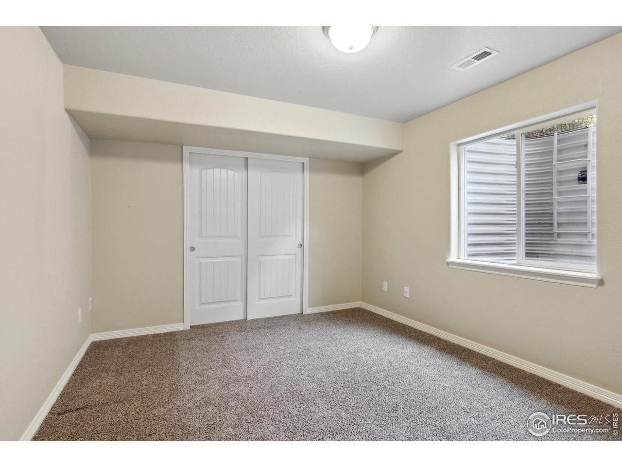9018 Sandpiper Drive Frederick, CO 80504 - Photo 24 of 26 a view of an empty room with a window