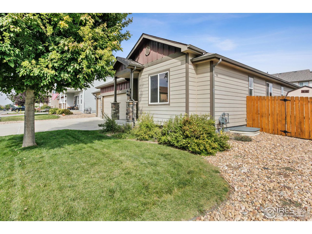 9018 Sandpiper Drive Frederick, CO 80504 - Photo 4 of 26 a front view of a house with garden