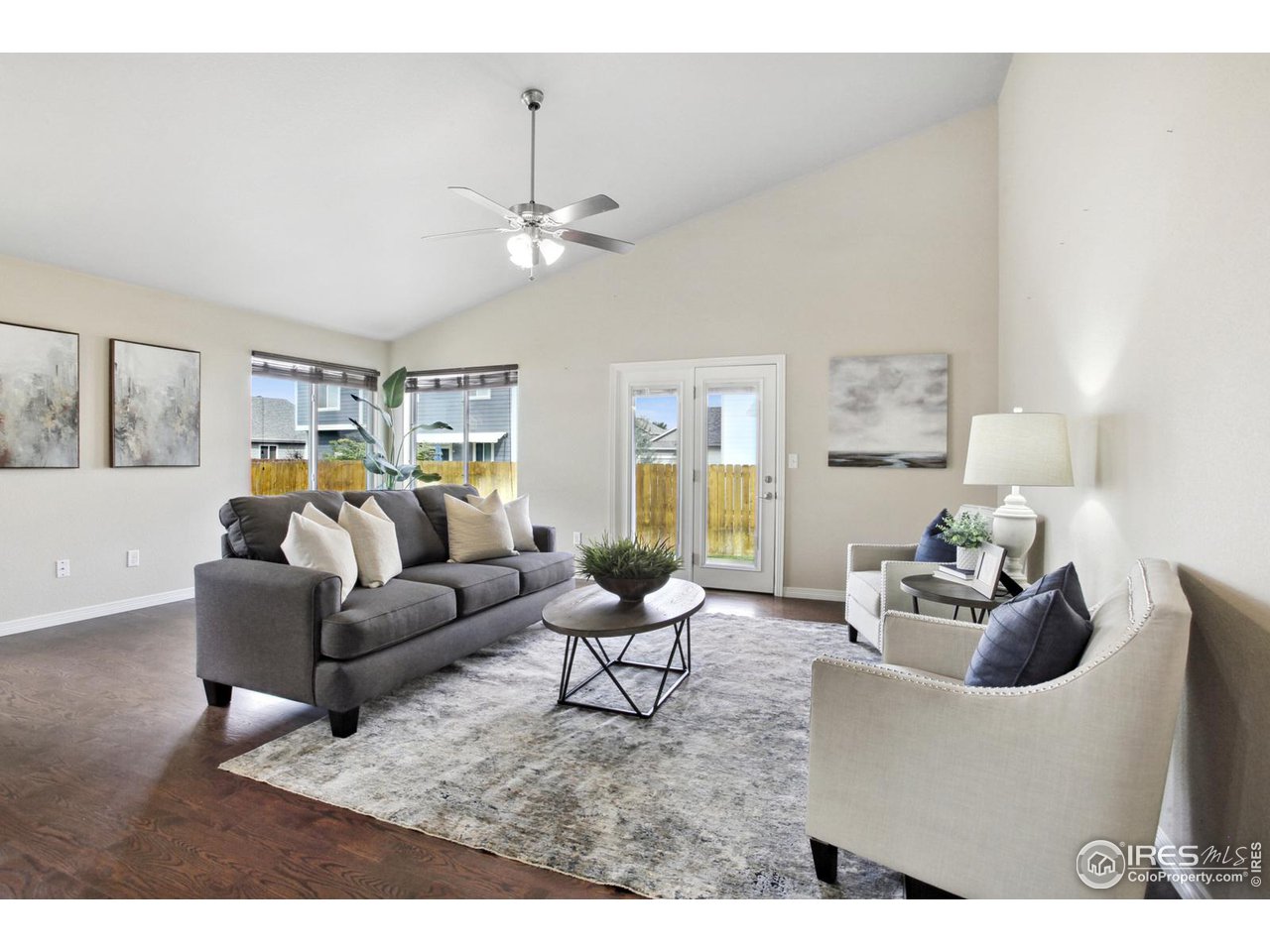 9018 Sandpiper Drive Frederick, CO 80504 - Photo 6 of 26 a living room with furniture and a chandelier