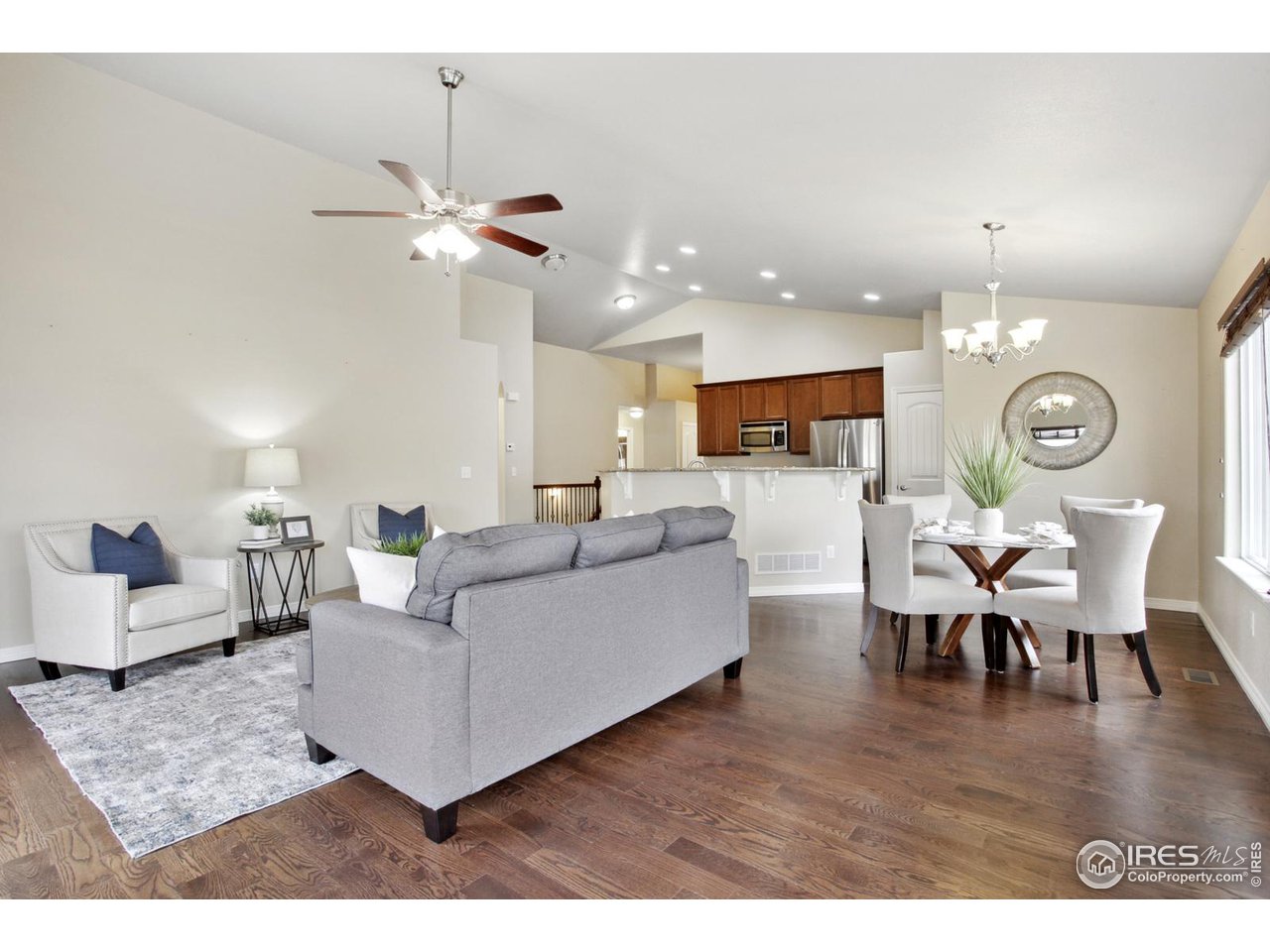 9018 Sandpiper Drive Frederick, CO 80504 - Photo 8 of 26 a living room with furniture and a wooden floor