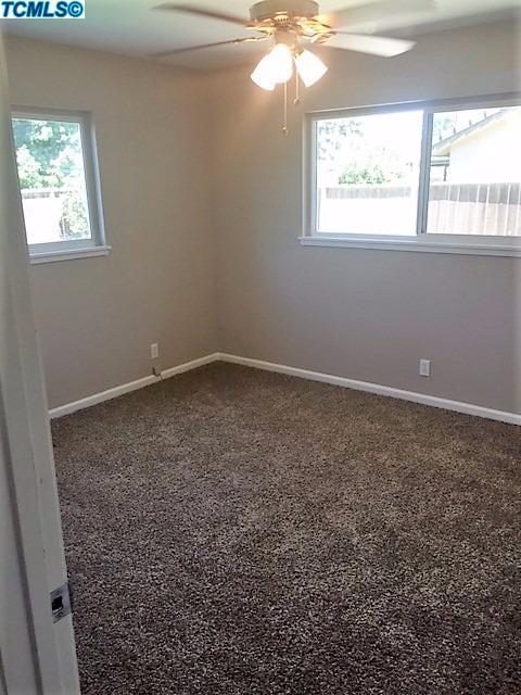 122 West Spring Lane Lemoore, CA 93245 - Photo 11 of 17 an empty room with a window