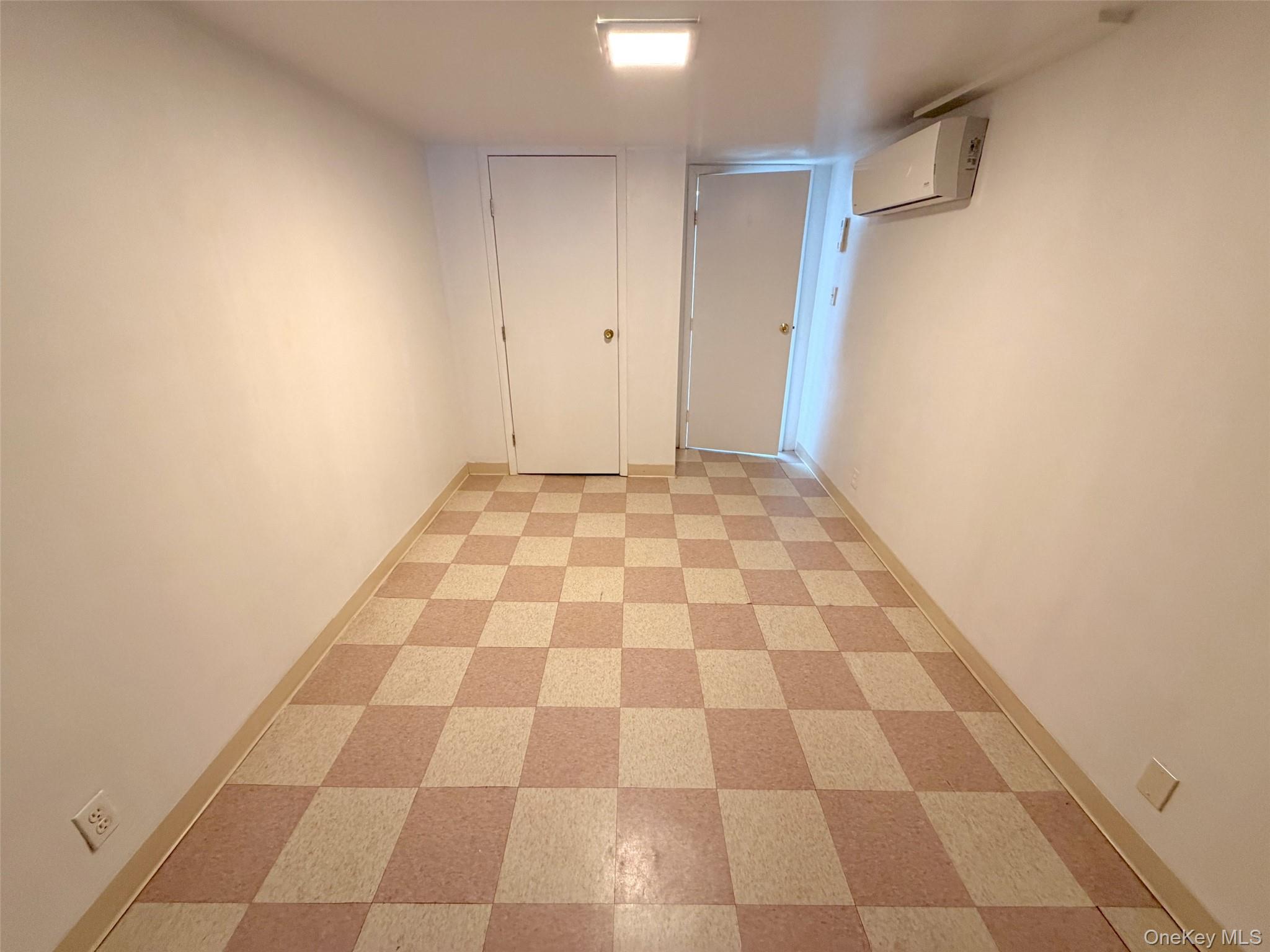 153-20 77th Road, Unit 1 Queens, NY 11367 - Photo 5 of 11 area featuring light floors and baseboards