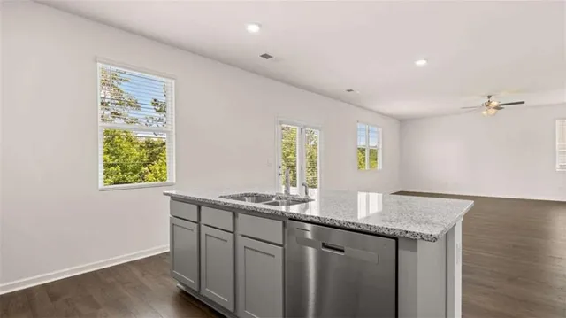 a kitchen with a sink and a window