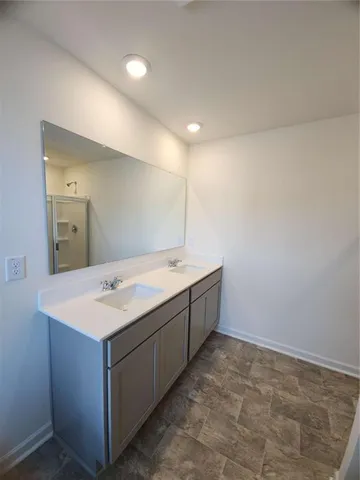 a bathroom with a sink a vanity and mirror