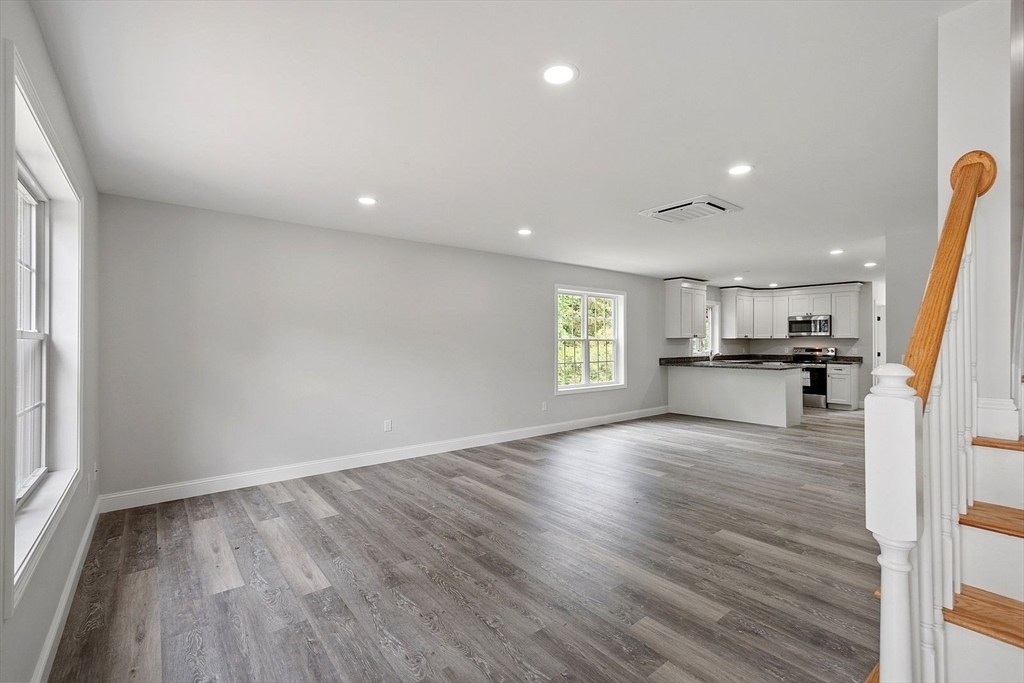 572 Pleasant Street Athol, MA 01331 - Photo 11 of 32 wooden floor in an empty room with a window