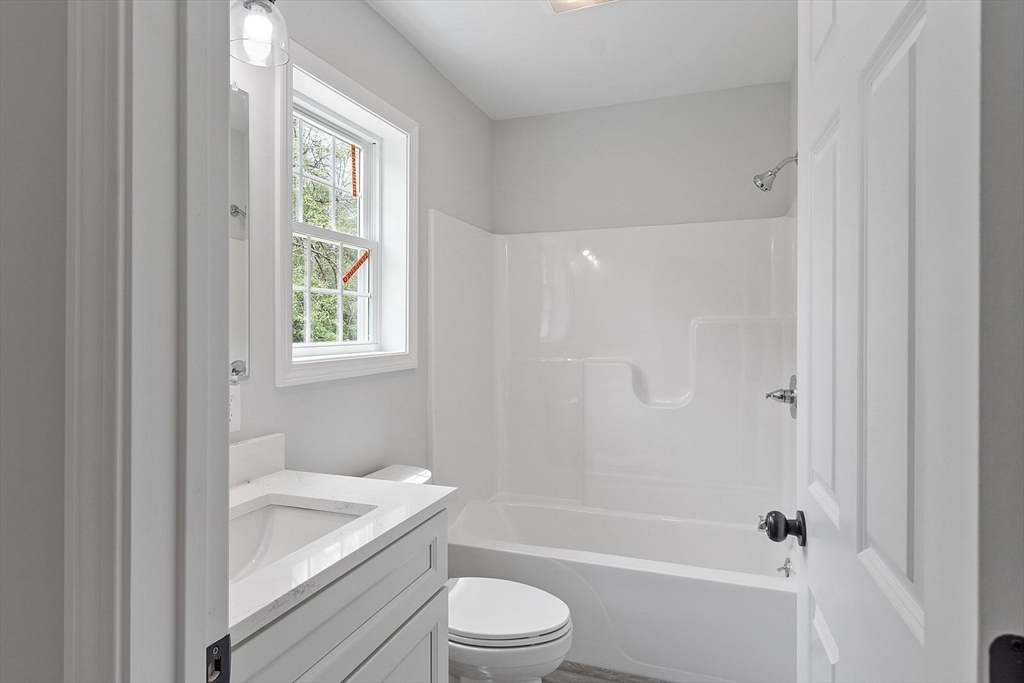 572 Pleasant Street Athol, MA 01331 - Photo 14 of 32 a bathroom with a sink a toilet and shower