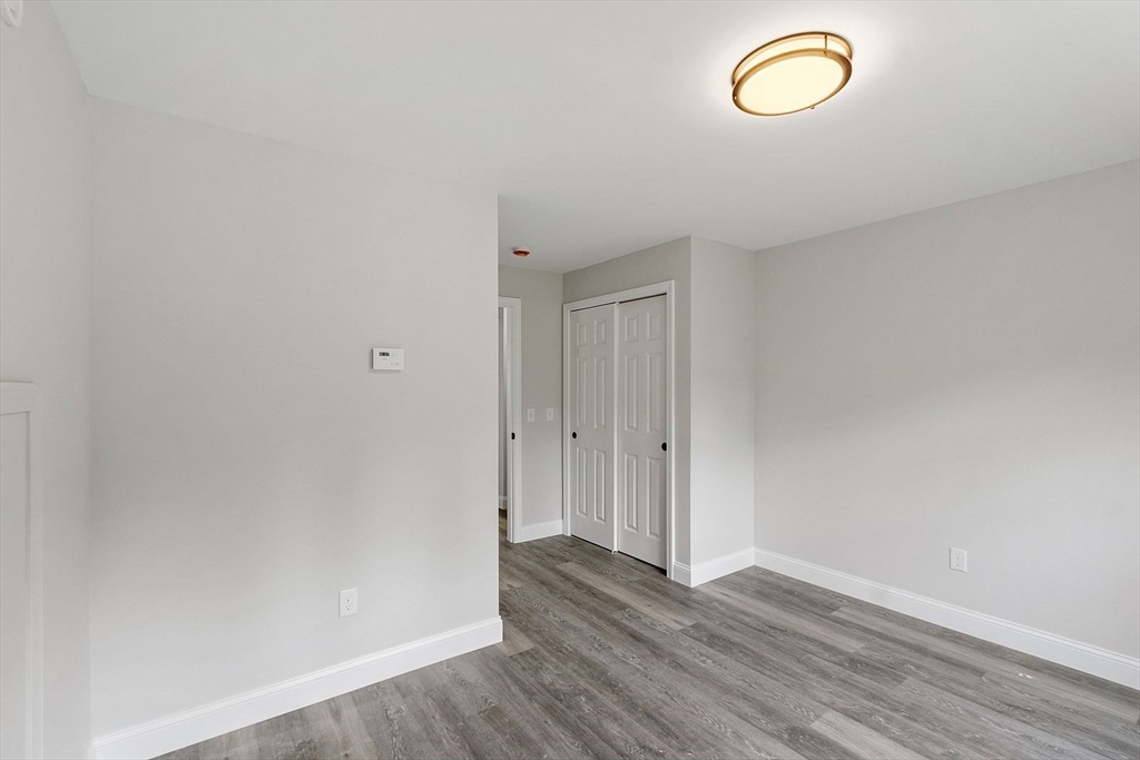 572 Pleasant Street Athol, MA 01331 - Photo 25 of 32 a view of room with wooden floor