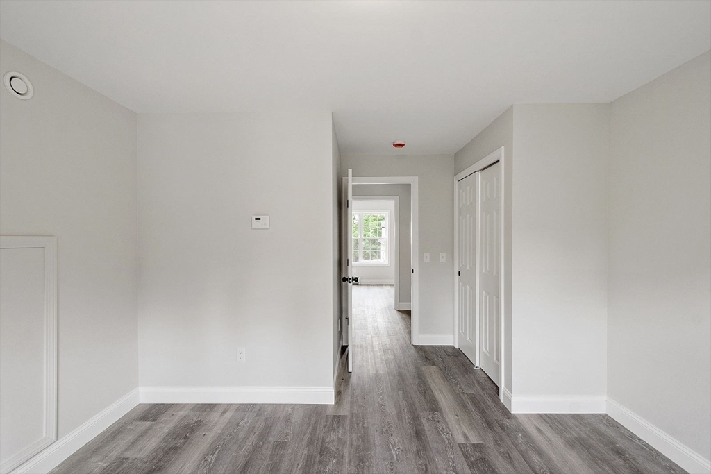 572 Pleasant Street Athol, MA 01331 - Photo 26 of 32 a view of wooden floor and windows in a room