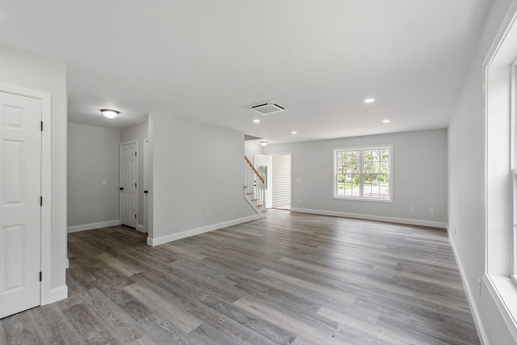 572 Pleasant Street Athol, MA 01331 - Photo 27 of 32 an empty room with wooden floor and windows