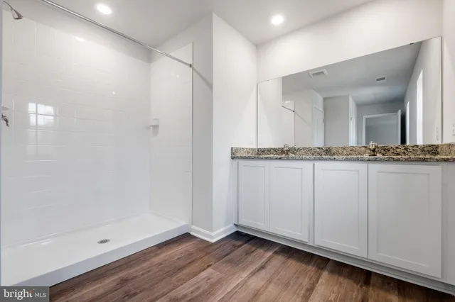a view of a hallway with chandelier