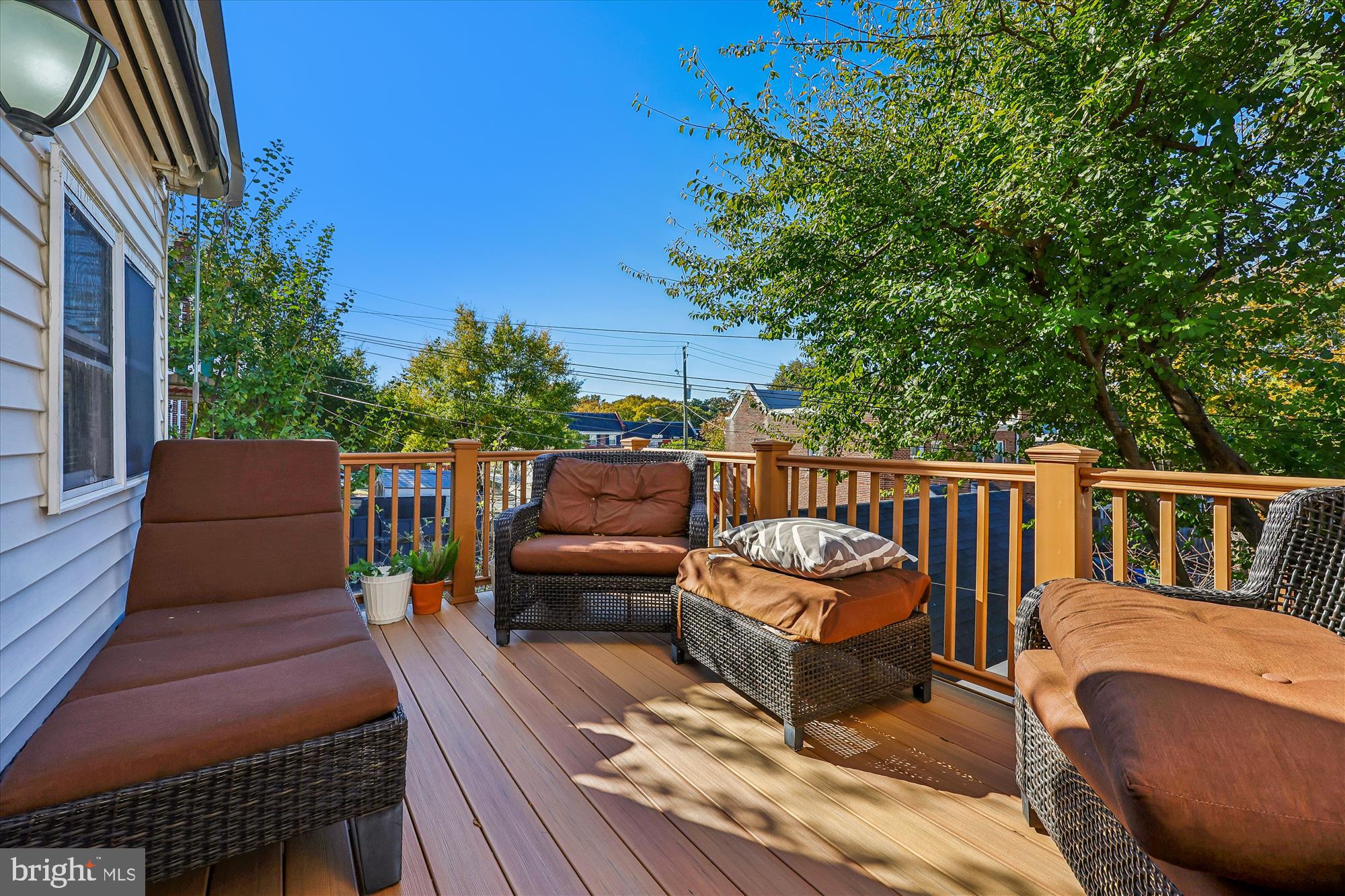 4808 Fort Totten Drive Northeast Washington, DC 20011 - Photo 12 of 30 a roof deck with a table and chairs and potted plants