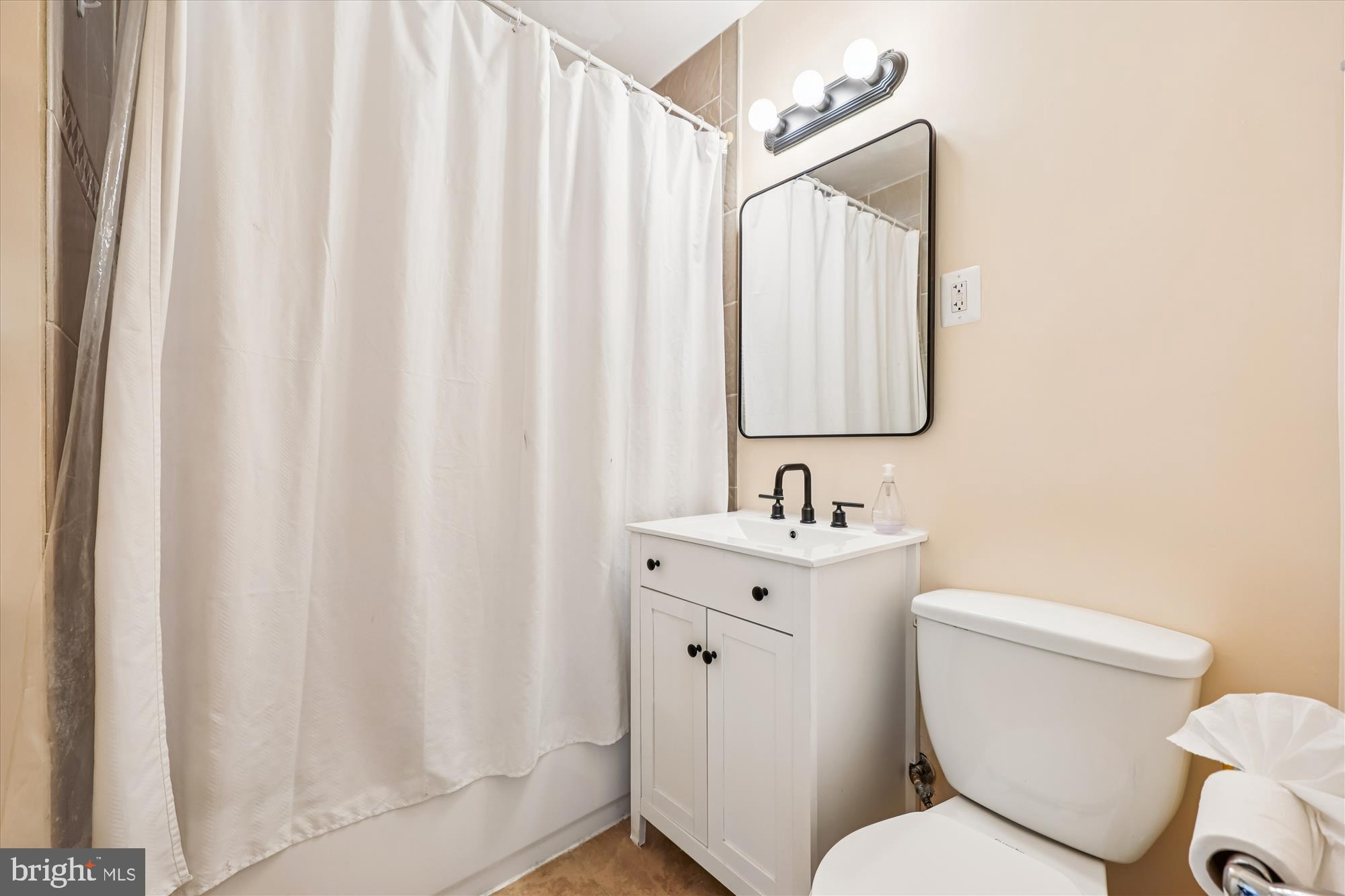 4808 Fort Totten Drive Northeast Washington, DC 20011 - Photo 14 of 30 a white toilet sitting next to a bathroom sink