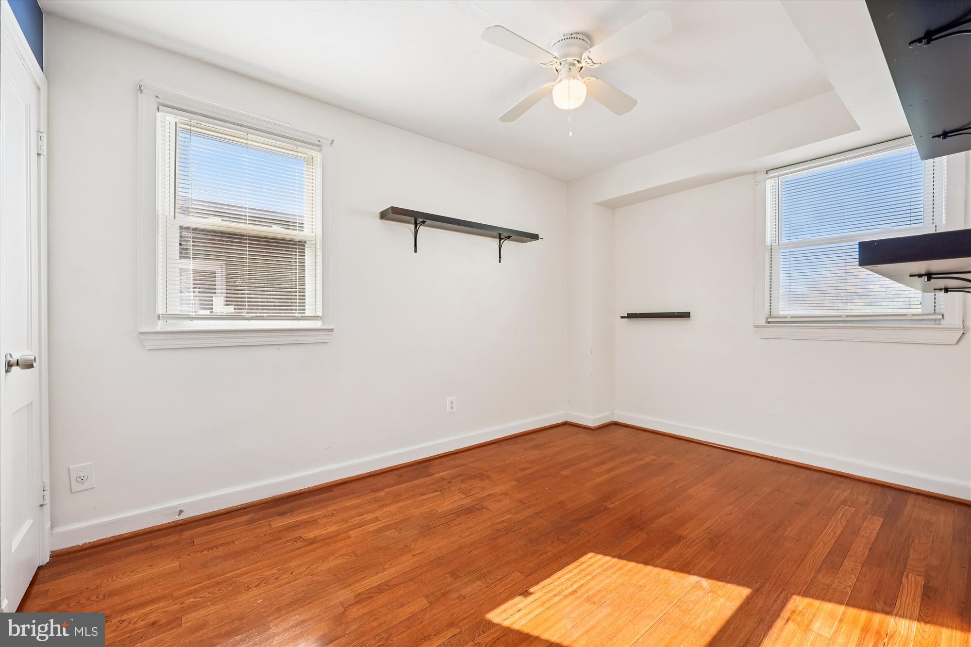 4808 Fort Totten Drive Northeast Washington, DC 20011 - Photo 15 of 30 a view of empty room with wooden floor and fan