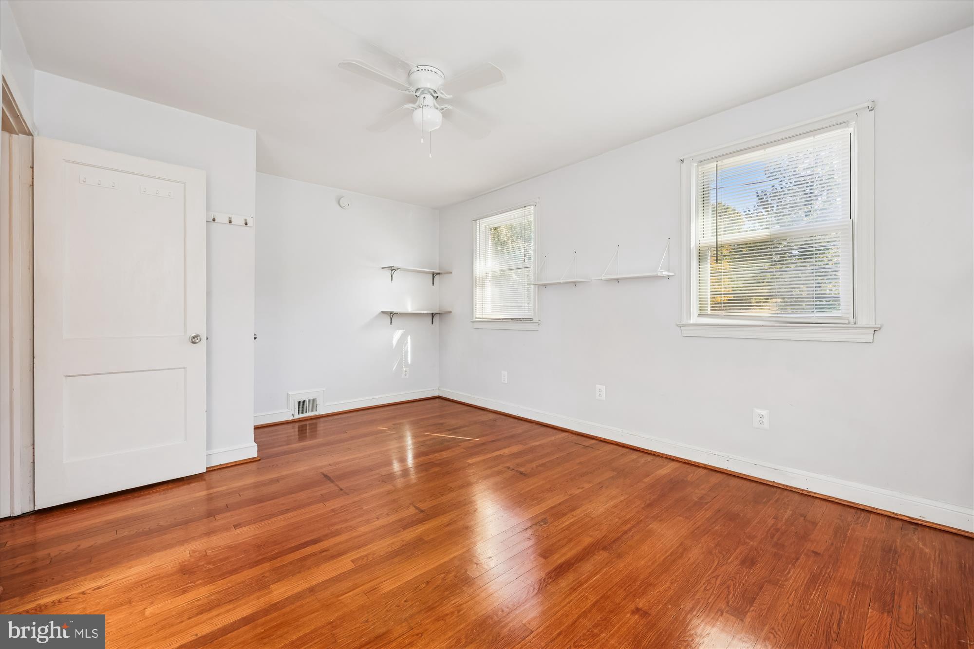 4808 Fort Totten Drive Northeast Washington, DC 20011 - Photo 21 of 30 a view of empty room with wooden floor and fan