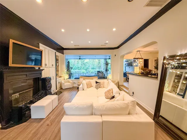 a view of a house with a yard patio and fire pit