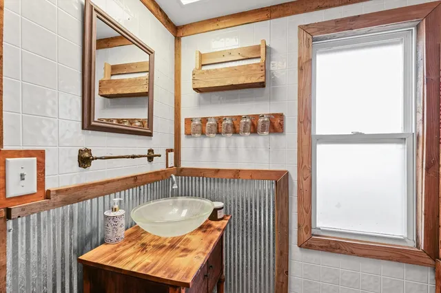 a view of a hallway with furniture and window
