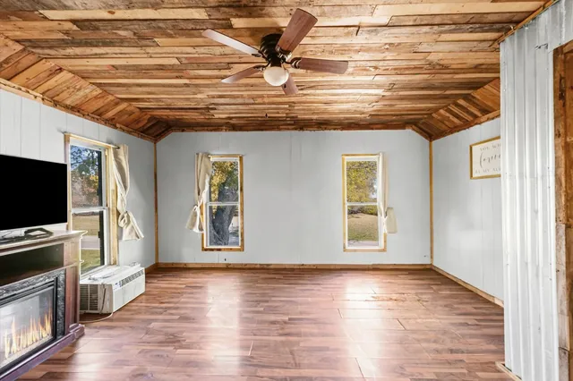 a view of livingroom with hardwood floor and a flat screen tv