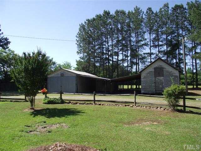 2661 Alderman Mill Road Dunn, NC 28334 - Photo 6 of 25 a backyard of a house with table and chairs