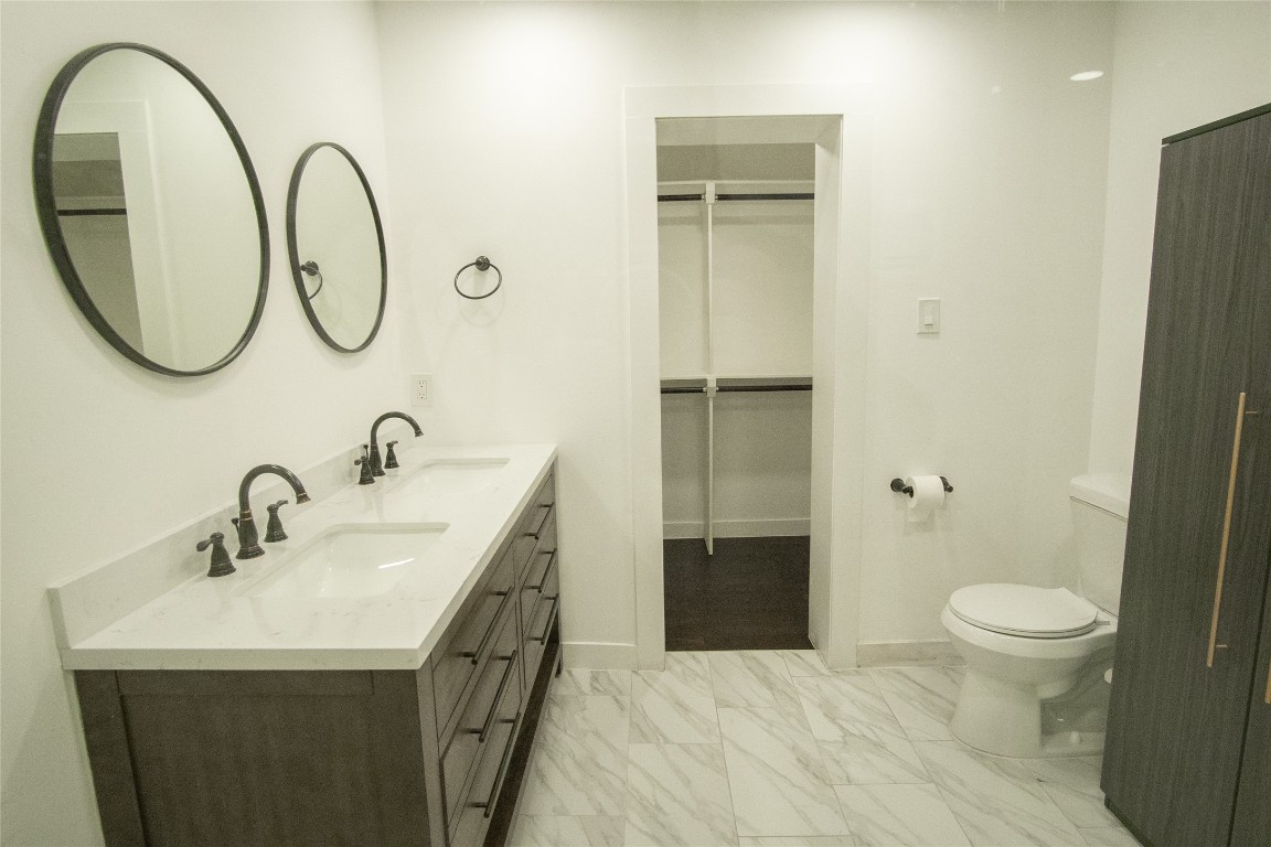 4423 Coyle Street Houston, TX 77023 - Photo 12 of 26 a bathroom with a sink and a mirror