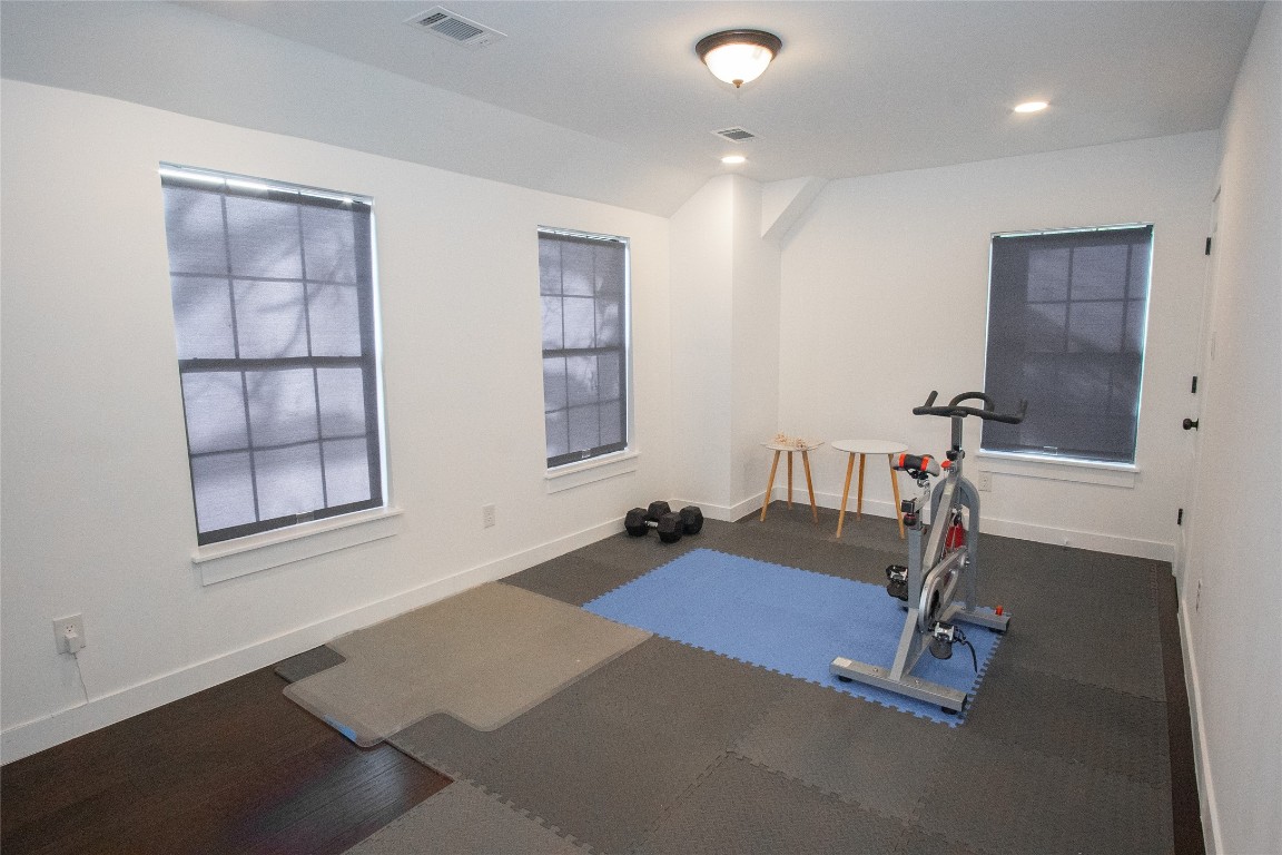4423 Coyle Street Houston, TX 77023 - Photo 13 of 26 a room with gym equipment and a window