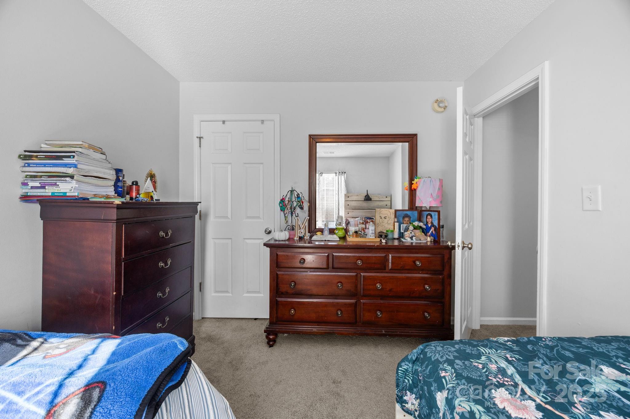 708 Raindrops Road Gastonia, NC 28054 - Photo 11 of 28 a bedroom with a bed and a dresser