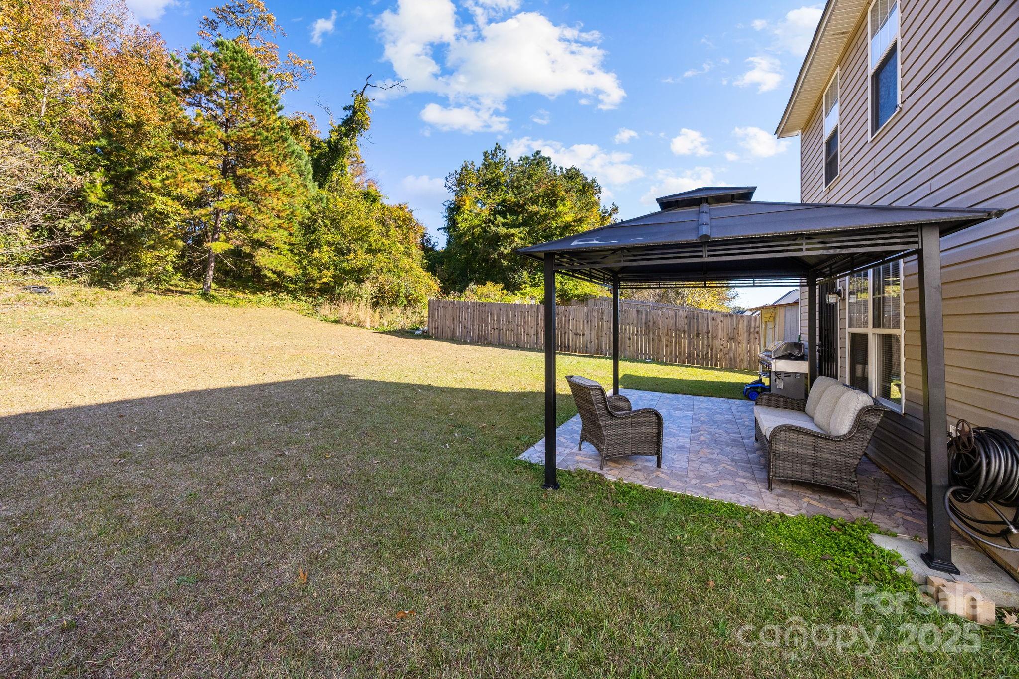 708 Raindrops Road Gastonia, NC 28054 - Photo 18 of 28 a view of a house with backyard and sitting area