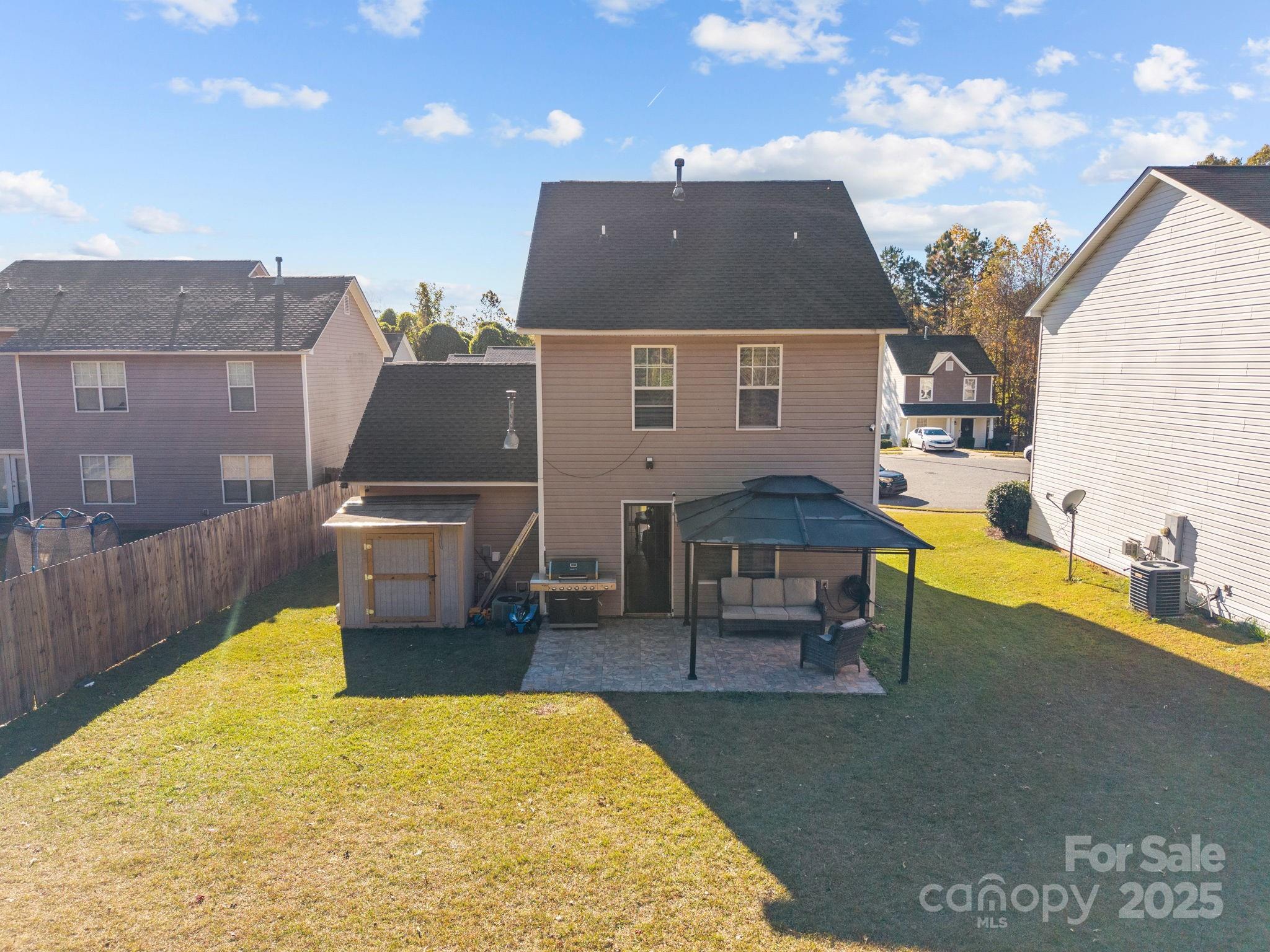 708 Raindrops Road Gastonia, NC 28054 - Photo 20 of 28 a aerial view of a house with swimming pool