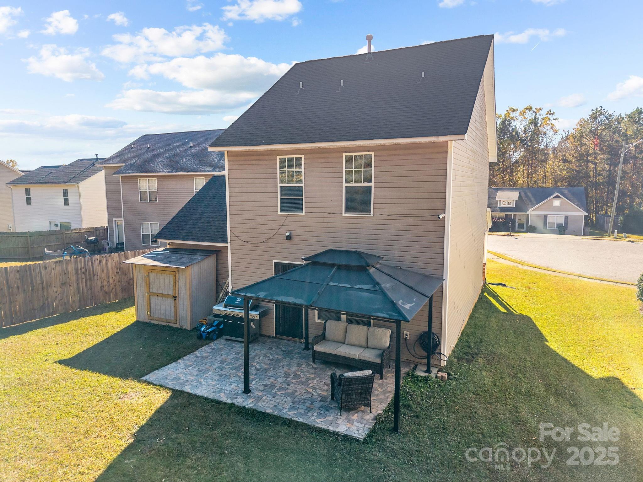 708 Raindrops Road Gastonia, NC 28054 - Photo 21 of 28 a view of a house with a backyard