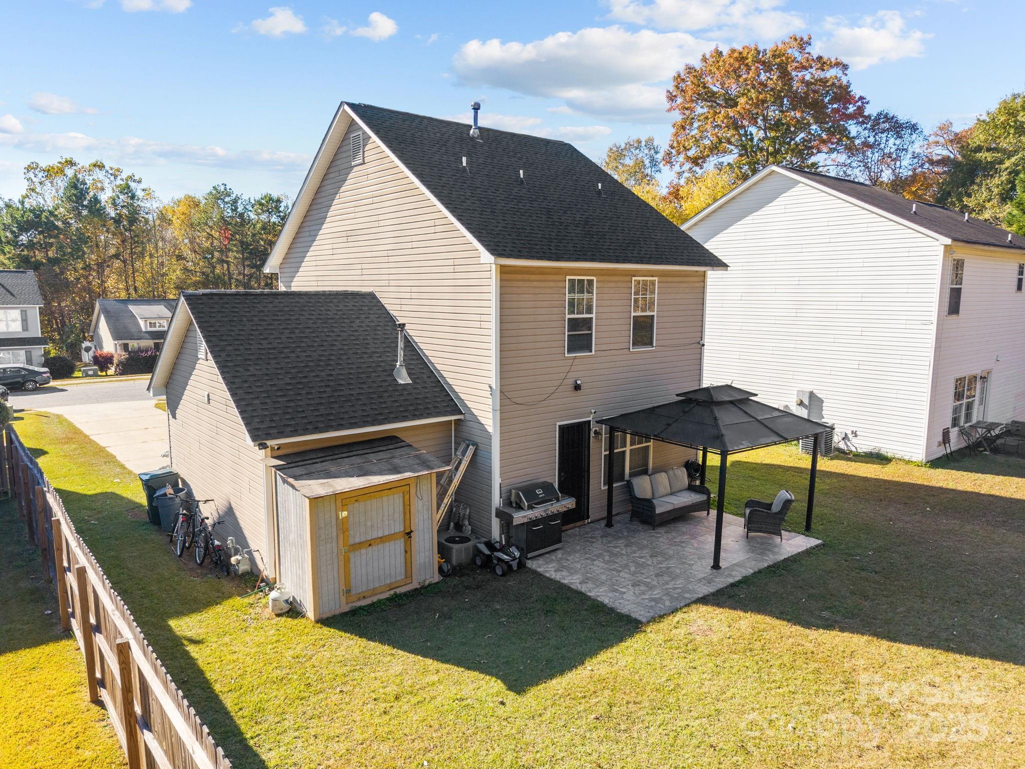 708 Raindrops Road Gastonia, NC 28054 - Photo 23 of 28 a aerial view of a house with swimming pool and sitting area