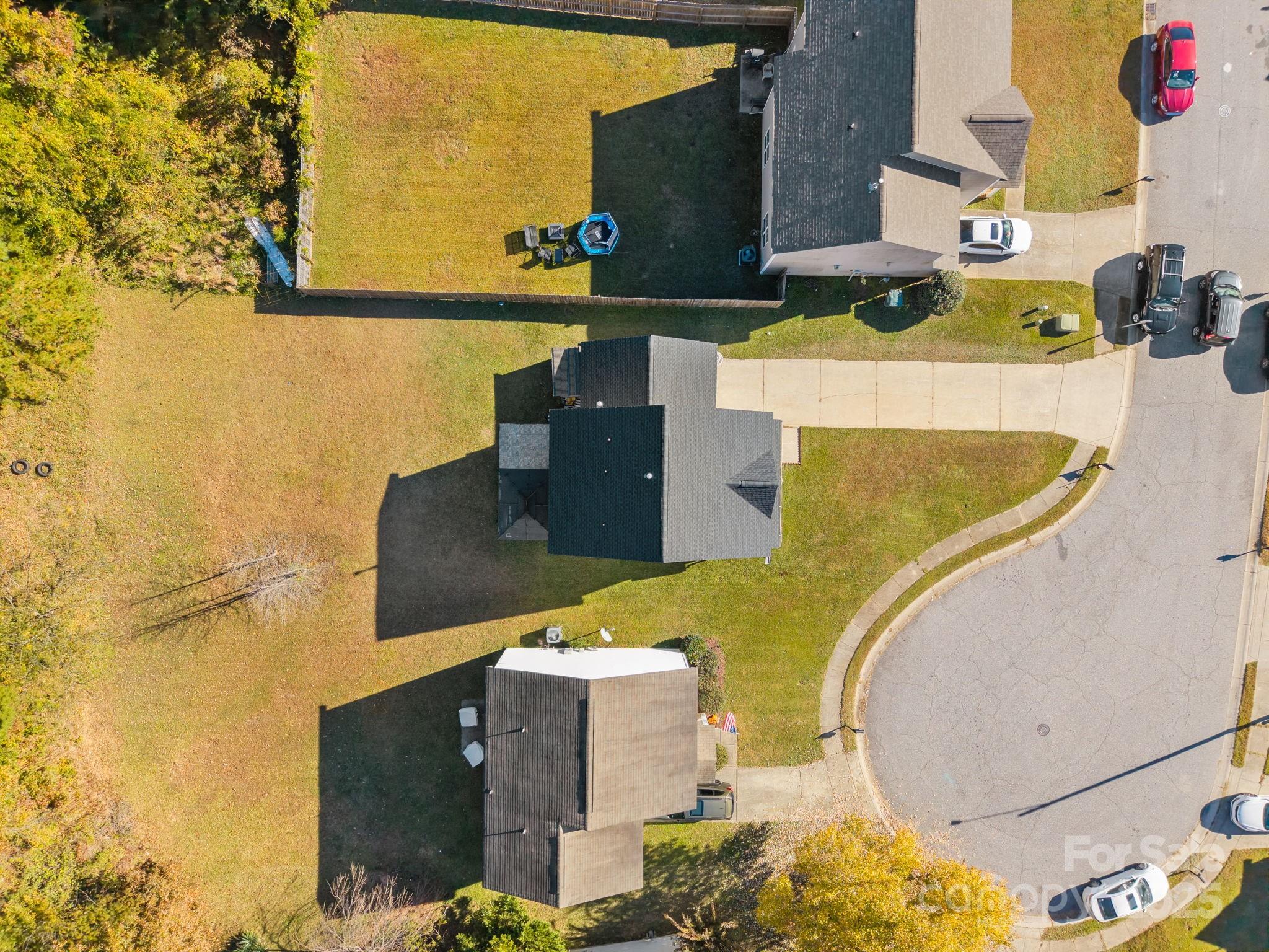 708 Raindrops Road Gastonia, NC 28054 - Photo 27 of 28 an aerial view of a house with a swimming pool