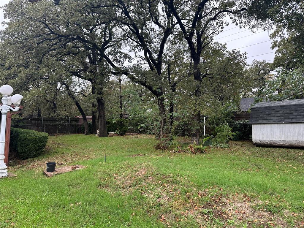532 Plainview Drive Hurst, TX 76054 - Photo 11 of 40 a view of a backyard with large trees