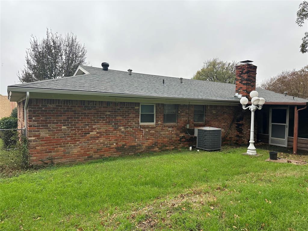 532 Plainview Drive Hurst, TX 76054 - Photo 12 of 40 a front view of a house with a yard and garage