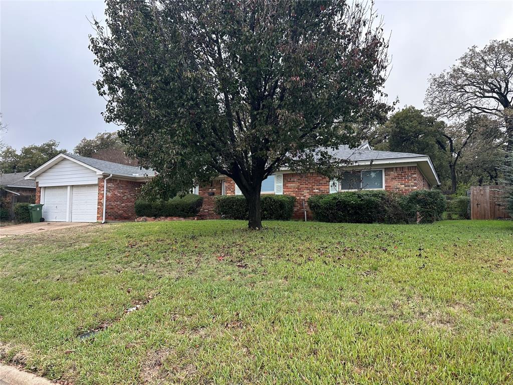 532 Plainview Drive Hurst, TX 76054 - Photo 2 of 40 a house view with a garden space