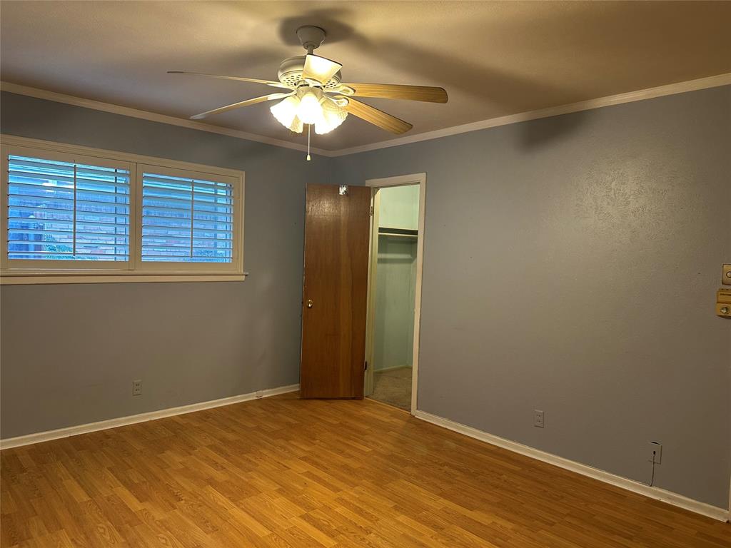 532 Plainview Drive Hurst, TX 76054 - Photo 24 of 40 a view of an empty room with a chandelier fan