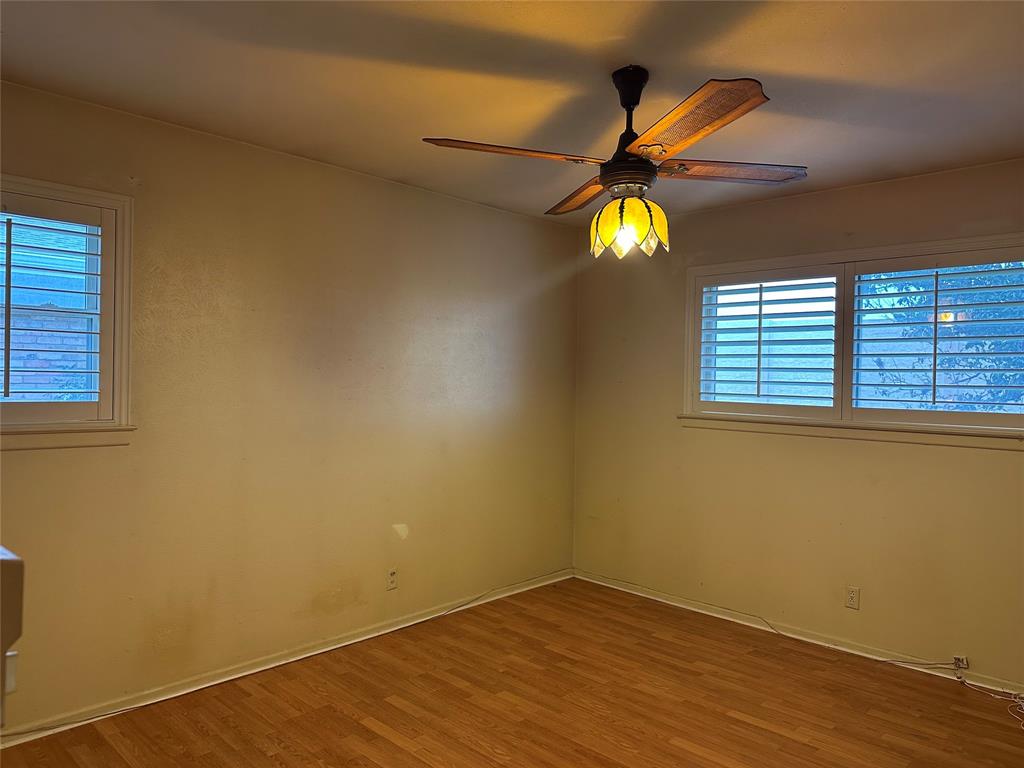 532 Plainview Drive Hurst, TX 76054 - Photo 28 of 40 a view of a room with wooden floor and windows