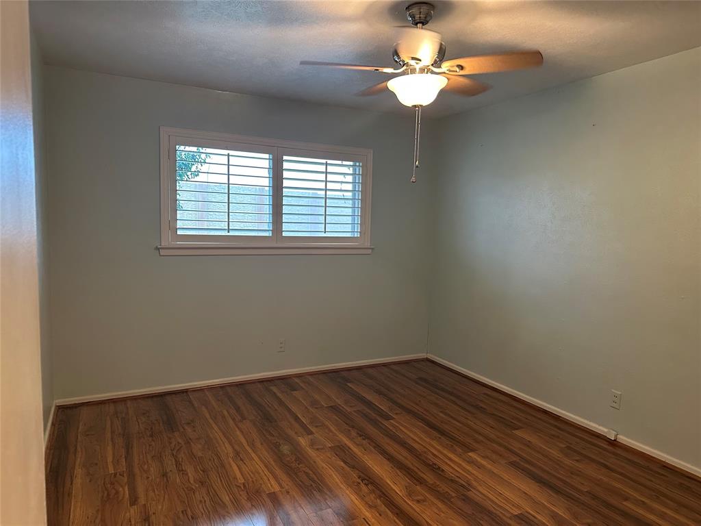 532 Plainview Drive Hurst, TX 76054 - Photo 31 of 40 wooden floor in an empty room with a window