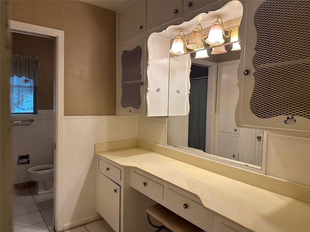 532 Plainview Drive Hurst, TX 76054 - Photo 32 of 40 a bathroom with a sink and a mirror