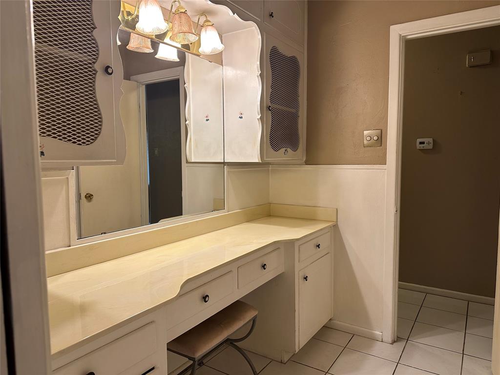 532 Plainview Drive Hurst, TX 76054 - Photo 33 of 40 a bathroom with a sink a vanity and a mirror