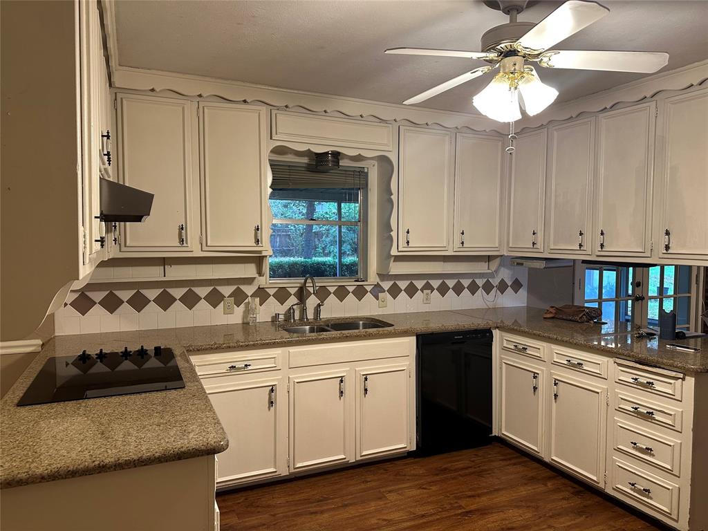 532 Plainview Drive Hurst, TX 76054 - Photo 38 of 40 a kitchen with a stove sink and cabinets