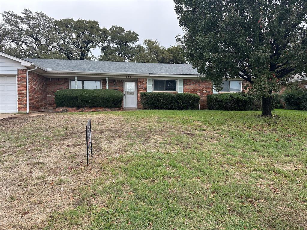 532 Plainview Drive Hurst, TX 76054 - Photo 5 of 40 a front view of house with yard and trees in the background