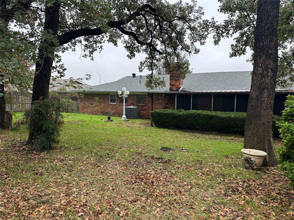 532 Plainview Drive Hurst, TX 76054 - Photo 10 of 40 a front view of a house with garden