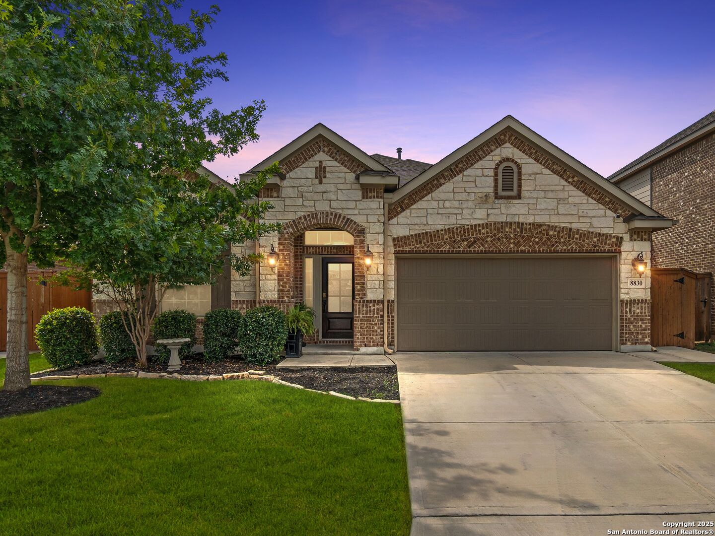 8830 Study Butte San Antonio, TX 78254 - Photo 1 of 1 a front view of a house with a yard and garage