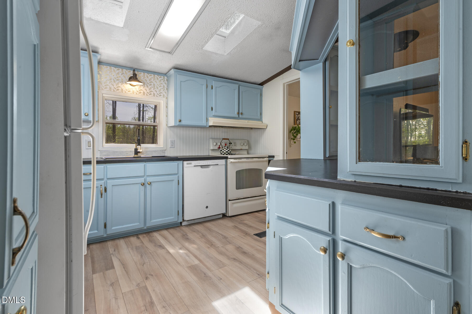 492 Little Mill Road Henderson, NC 27537 - Photo 12 of 39 a kitchen with a sink cabinets and window