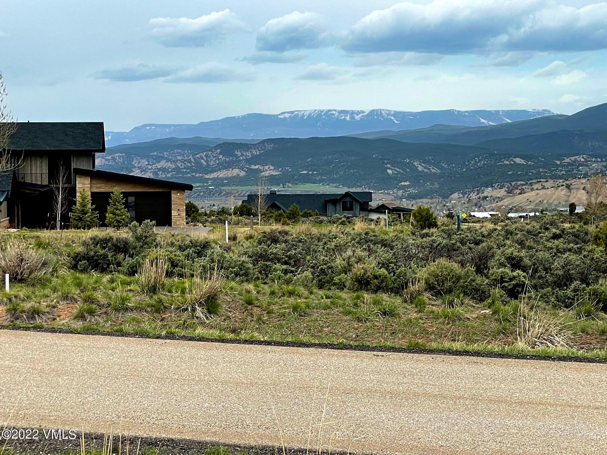38 Prospect Peak Road Eagle, CO 81631 - Photo 5 of 7 an aerial view of a house with a yard and mountain view